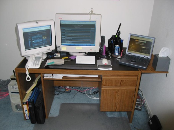 Rearrangment... Dual monitors on the left for my home system, Laptop on the right.