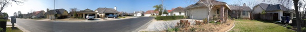 My first panoramic shot. I didn't use stich mode, I used an external program to patch them together. This is of my house, the house you are closest to (toward the middle right) is mine! I didn't lock the exposure and this is why you can see where the pics were stiched together...