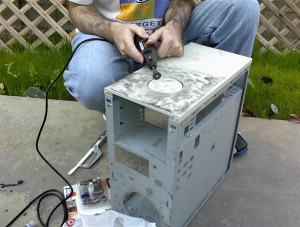 Dremel tool vs. top 80mm fan hole. You can see that' I've already cut out the front 120mm fan hole.