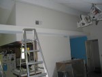 day 6:  i hate cathedral ceilings now.. that ladder is 8' and closer in the picture... 2 coats latter w/ rollers, we gave up. we're renting a spray gun. cathedral style high-vaulted cielings w/ popcorn acoustical finish.. pfft.. and this is room 1 of 3 like this..