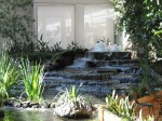 one of the waterfalls at an indoor massive garden.